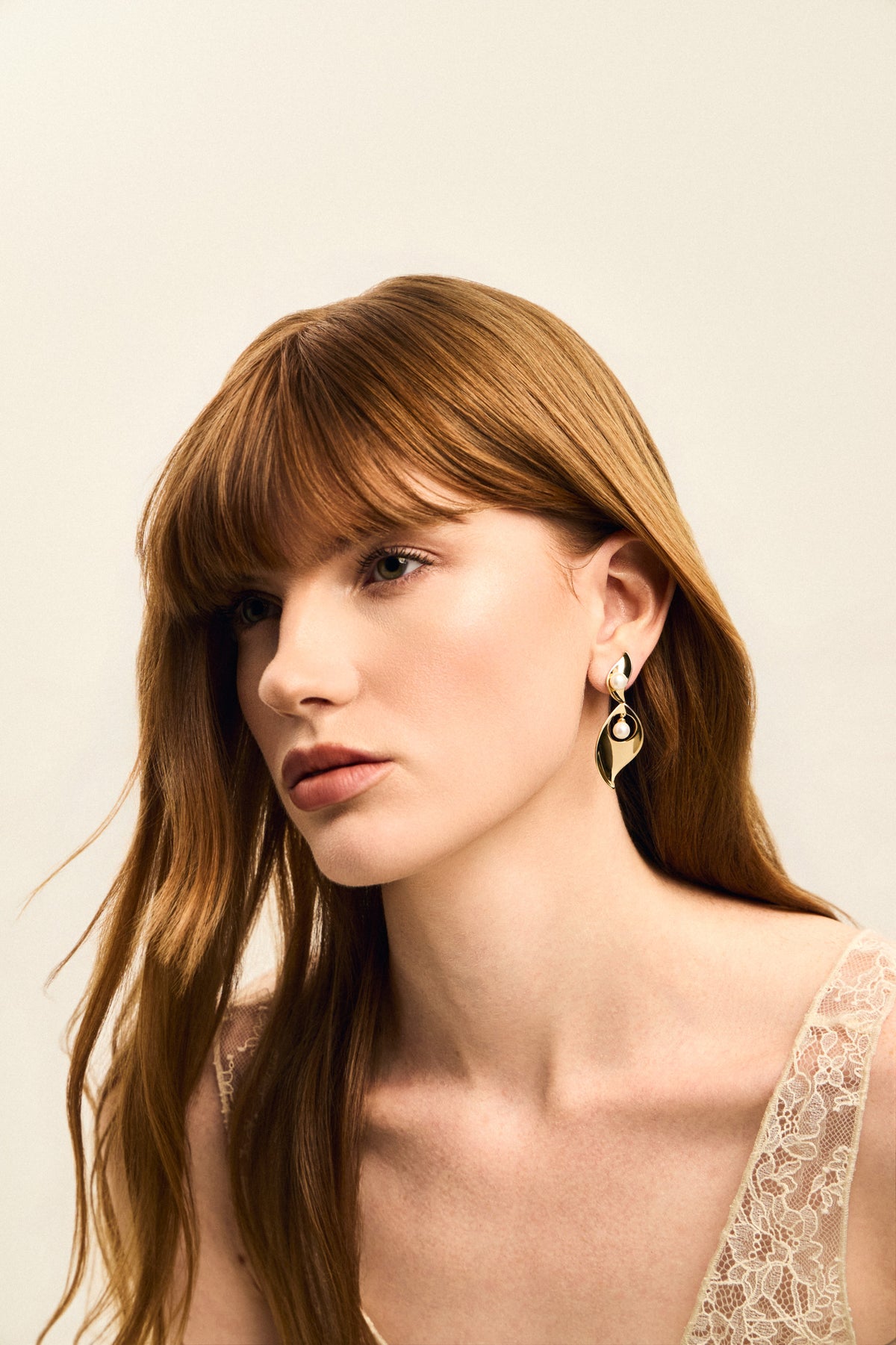 Model wearing SOIE earrings by Balbino