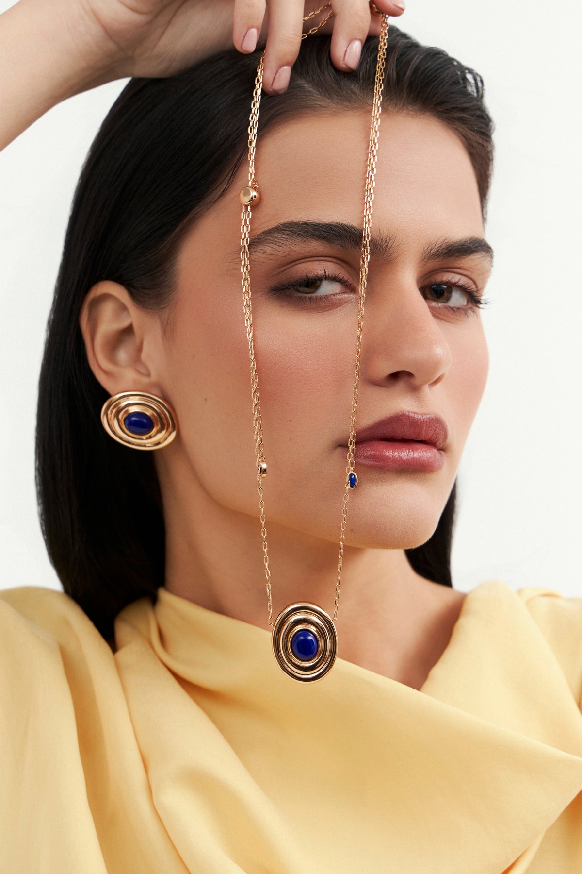 Model wearing Bossa maxi earrings by Balbino