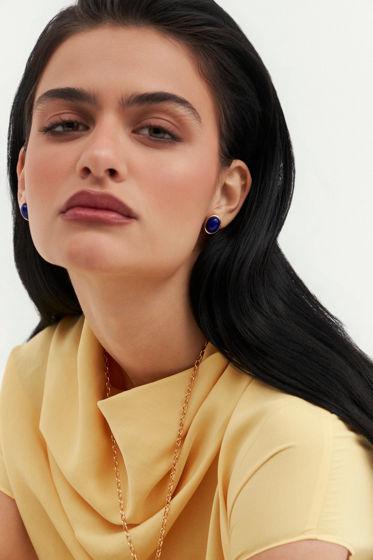 Model wearing Bossa Stud earrings by Balbino