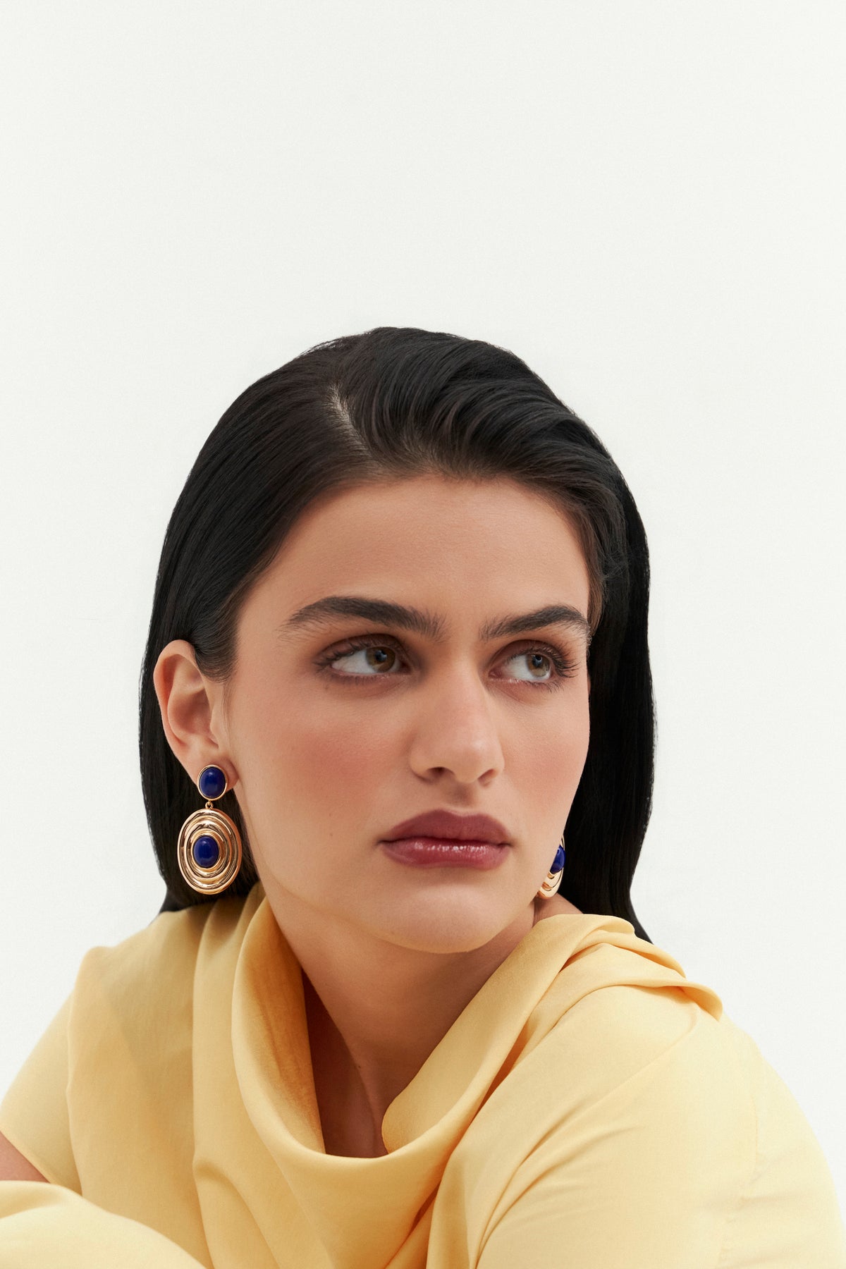 Model wearing Bossa Drop earrings by Balbino